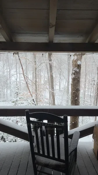 Cabin deck covered in snow